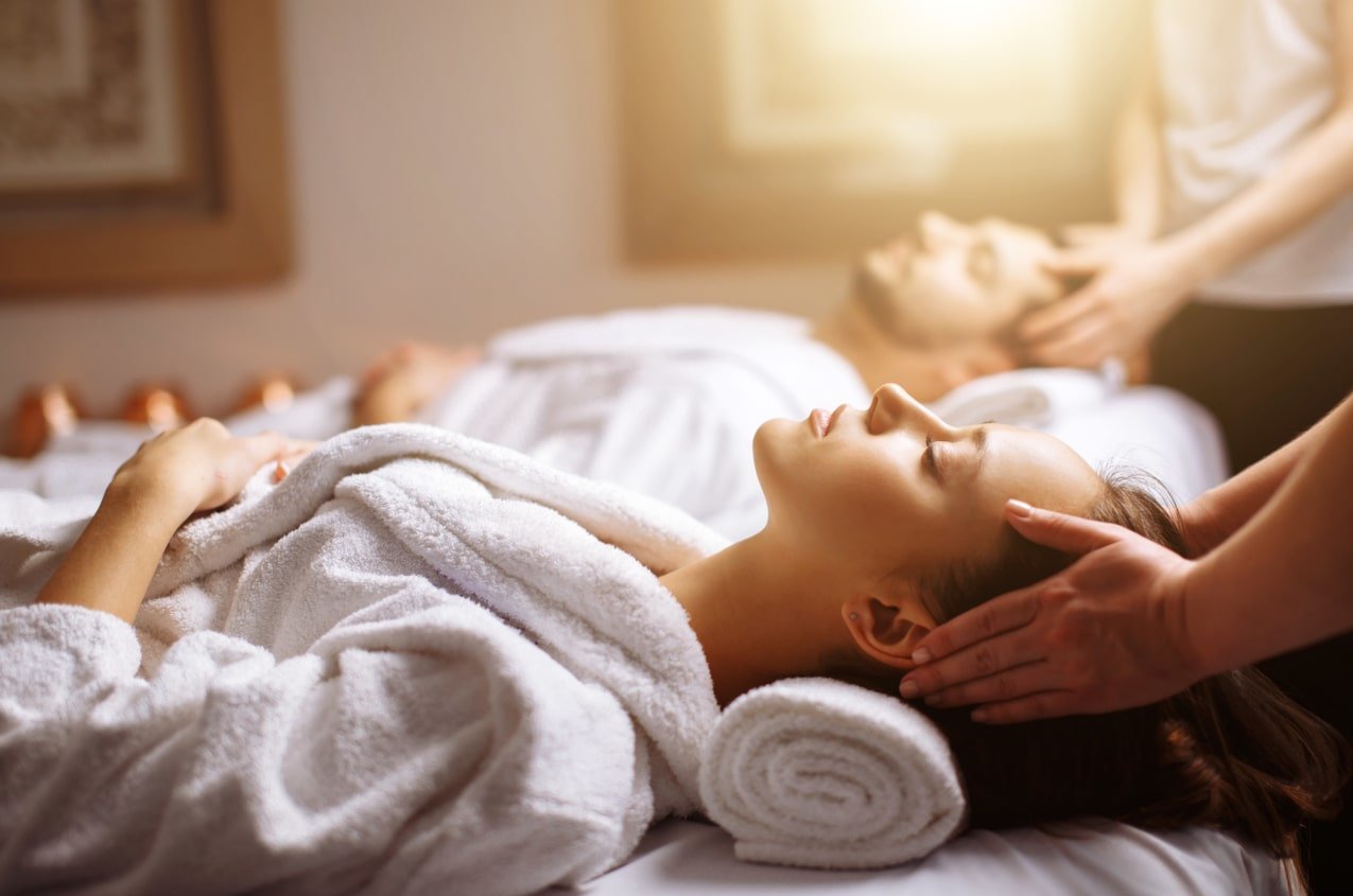 A couple receives a massage at a spa together