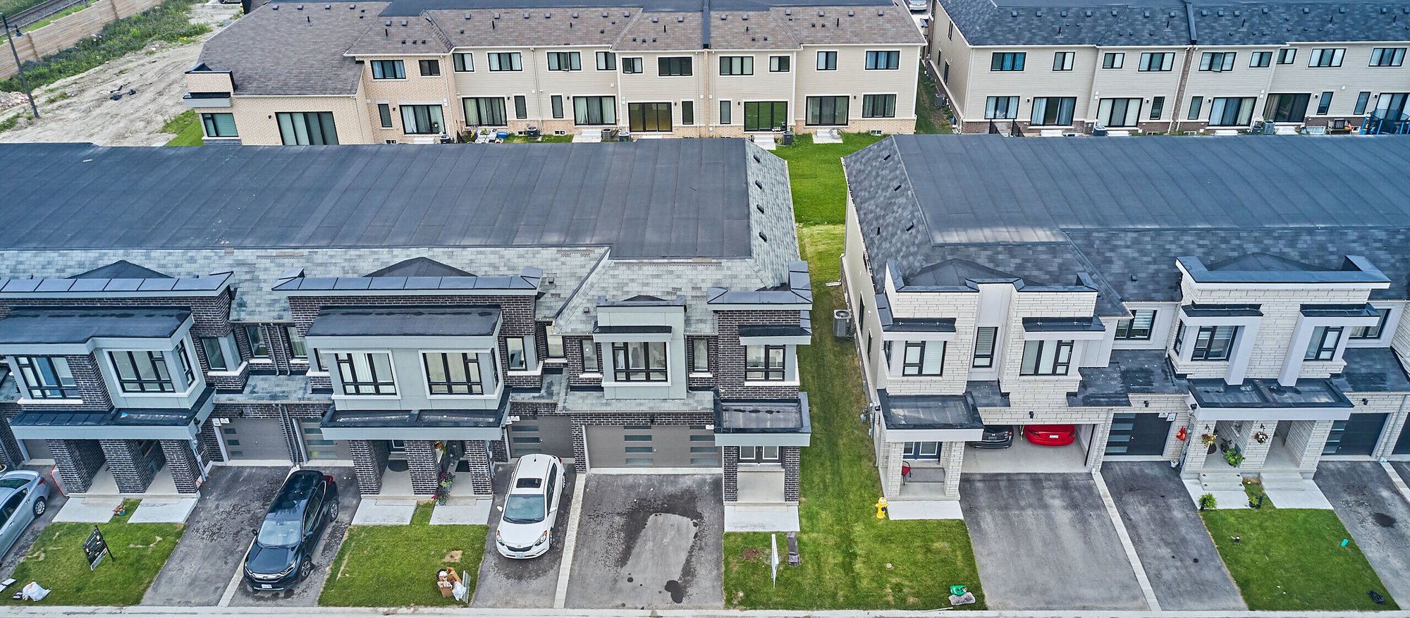 Aerial view of row of new construction townhomes